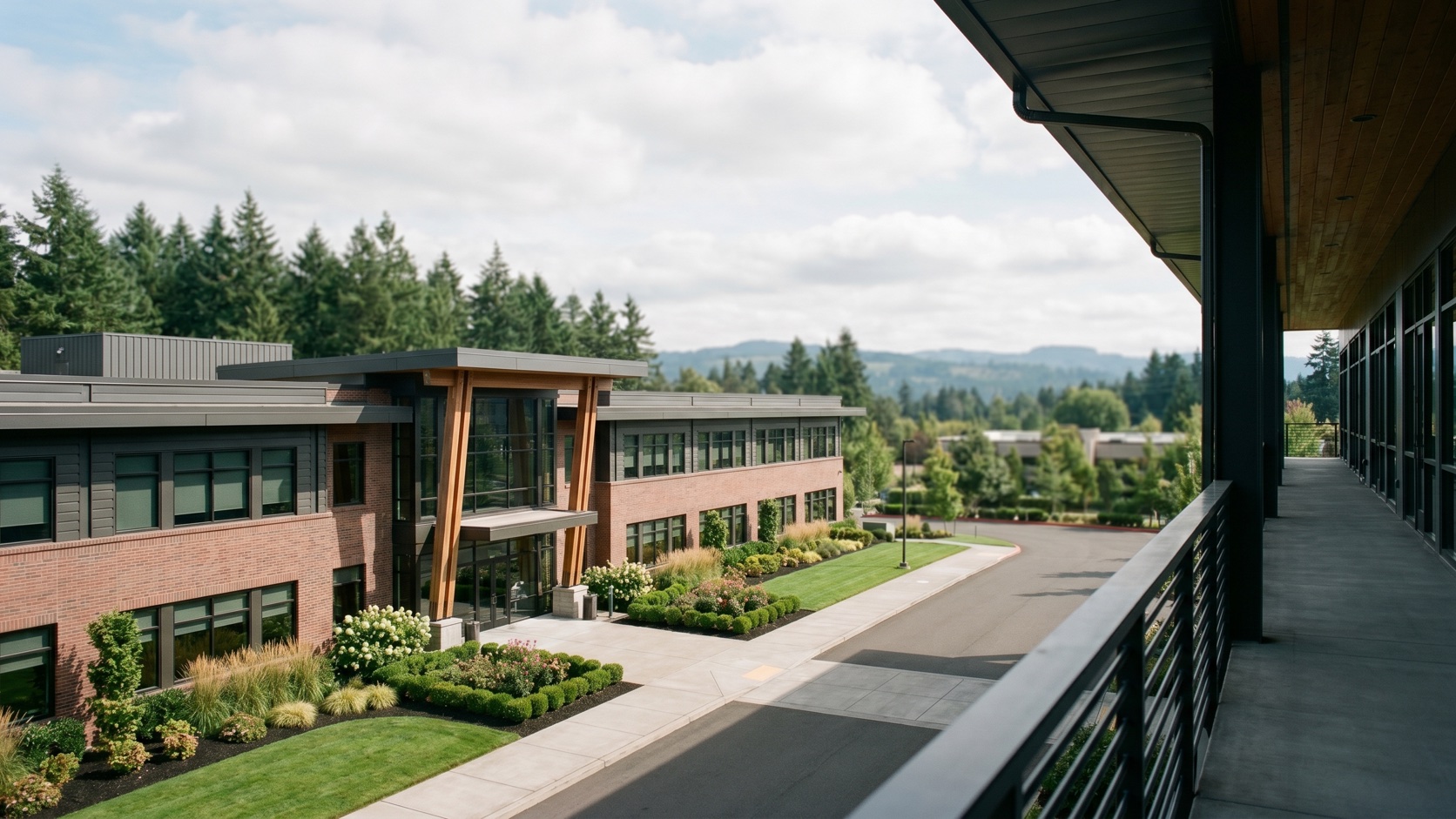 Clean, polished commercial office exterior in the Portland westside tech corridor at dusk with Douglas fir backdrop